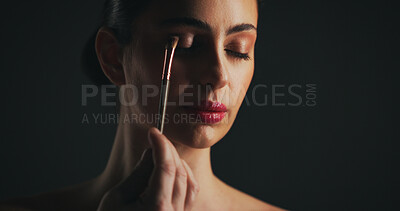 Buy stock photo Cosmetics, brush and woman in studio with eyeshadow, beauty or facial routine with products. Makeup, aesthetic and female person with tool for cosmetology treatment for glow on black background