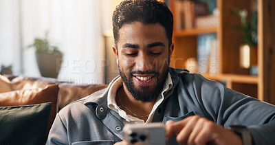 Buy stock photo Happy, phone and man on sofa for social media, online connection and text message on weekend. Living room, relaxing and person typing on smartphone for website, contact and communication in home