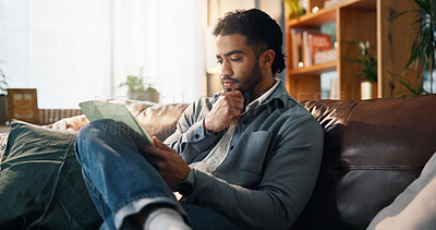 Buy stock photo Home, thinking and man on sofa, tablet and online reading with connection, ideas and relax. Apartment, ebook and person with tech, choice and internet with review for novel, website info and decision