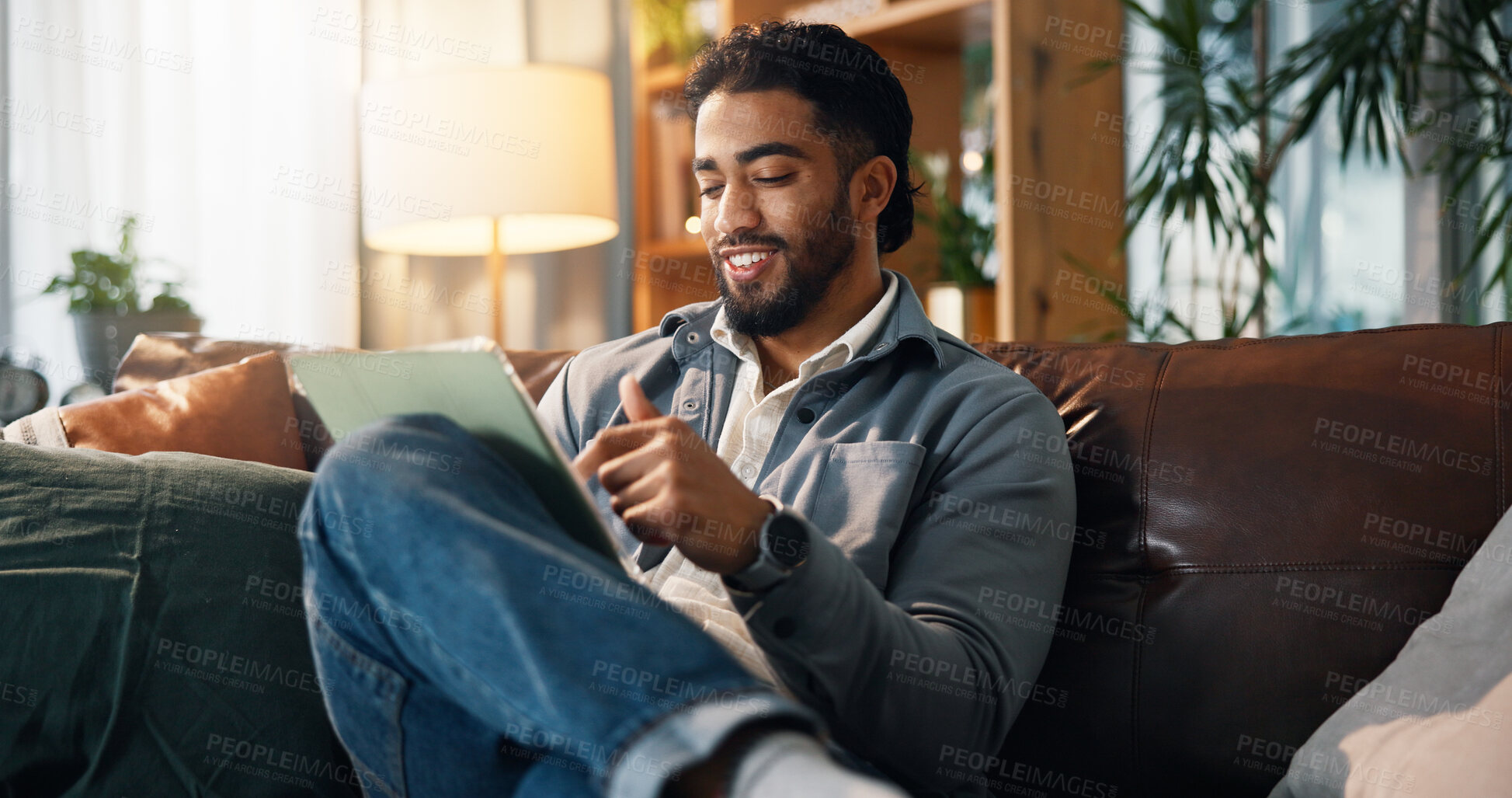 Buy stock photo Remote work, man and happy with tablet on sofa for small business development, research or planning. Freelance entrepreneur, person and smile with digital app in home for startup proposal and review