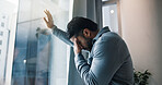 Headache, businessman and window with stress for bankruptcy, company liquidation or financial crisis at office. Frustrated, man or employee with anxiety, strain or pressure for mistake or failure