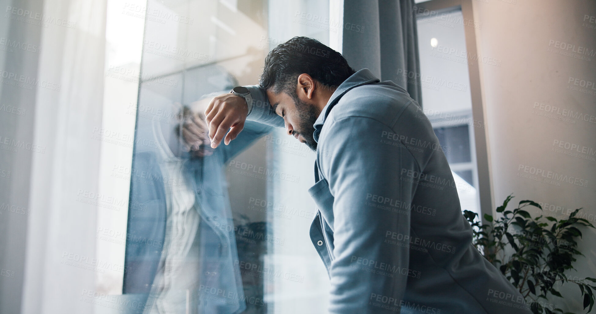 Buy stock photo Anxiety, businessman and window with stress for bankruptcy, company liquidation or financial crisis at office. Frustrated, man or employee with headache, strain or pressure for mistake or failure