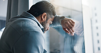 Buy stock photo Frustrated, businessman and window with stress for bankruptcy, company liquidation or financial crisis at office. Burnout, man or employee with anxiety, strain or pressure for debt mistake or failure