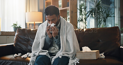 Buy stock photo Sick man, sofa and blowing nose with tissue for virus, flu or viral infection in home. Male person, blanket and cold with illness, disease or fatigue for nasal hayfever, allergy or sinus in house