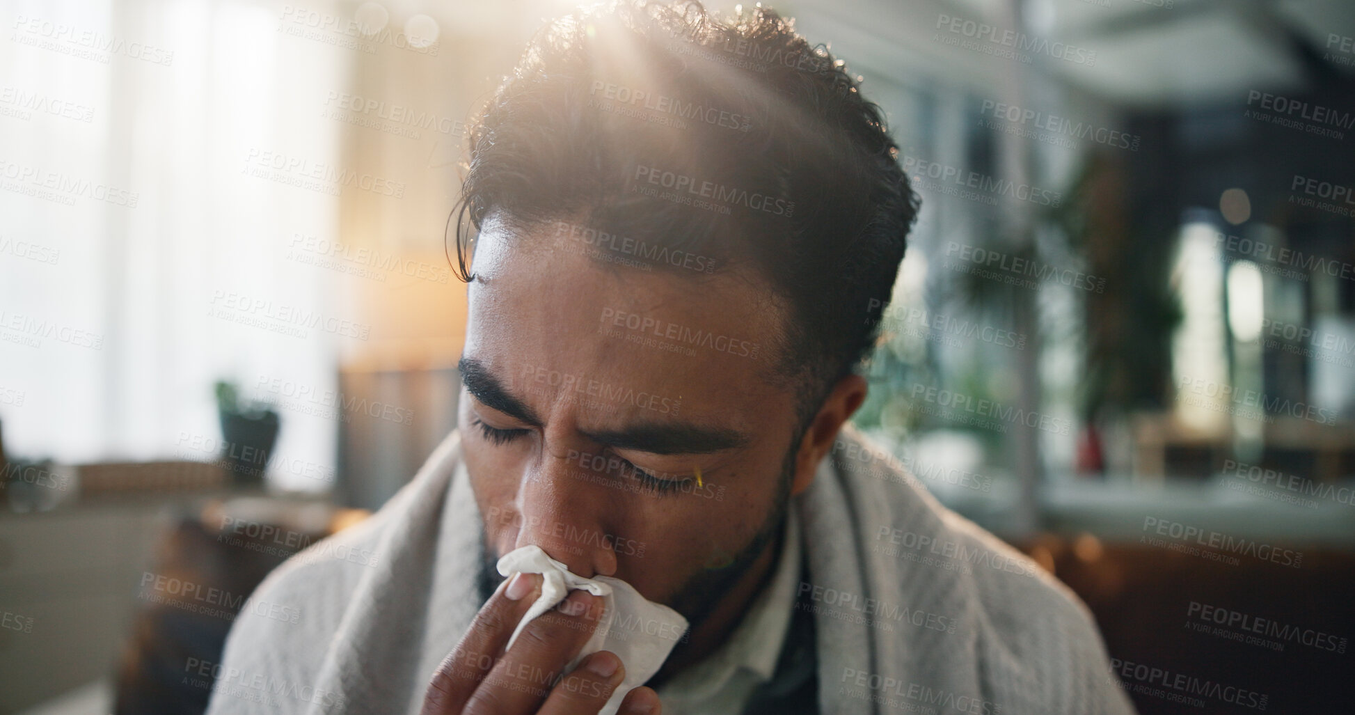 Buy stock photo Sick man, home or blowing nose with tissue for flu symptoms, cold or hayfever on sofa. Male person, influenza or illness with respiratory infection for sinus inflammation or nasal congestion in house