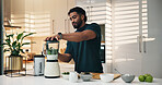 Smoothie, kitchen and man in home for nutrition, breakfast and snack or diet. Blender, weight loss and male person with organic ingredients for health, wellness or morning fruit drink in house