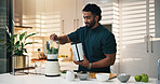 Protein shake, kitchen and man in home for nutrition, breakfast and snack or diet. Blender, weight loss and male person with organic ingredients for health, wellness or morning fruit drink in house