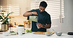 Blender, kitchen and man in home for nutrition, breakfast and snack or diet. Smoothie, weight loss and male person with organic ingredients for health, wellness or morning fruit drink in house