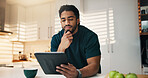 Tablet, thinking and man with coffee in kitchen in morning with networking, communication or app. Technology, research and person with cappuccino for texting, contact or social media in apartment.