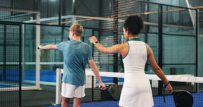 Buy stock photo Padel, training and coach with kid, fitness and motivation with help, teaching and sports. Technique, instructor and people with swing practice, coordination exercise and advice with performance tips