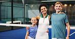 Woman, coach and portrait with children for padel tennis, training or indoor practice together. Female person, sports trainer and hug with active students for friendly game, match or fitness course