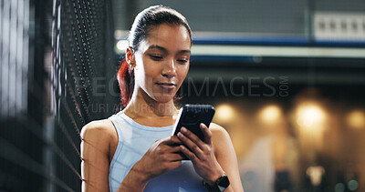 Buy stock photo Sport, woman and typing with phone at tennis court for texting, internet browsing and fitness break. Exercise, night and athlete with smartphone at padel club for reading notifications or mobile chat