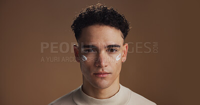 Buy stock photo Skincare, cream and portrait of man in studio for wellness, skin hydration and anti aging cosmetics. Mockup space, dermatology and person for facial treatment, grooming and beauty on brown background