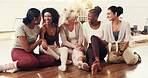 Happy, group and women on floor for yoga exercise, pilates workout and wellness together Friends, trainer and people laughing in conversation at fitness club for health, support and connection