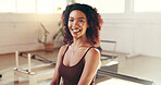 Portrait, happy and pilates reformer for woman, gym and equipment for workout, healthy and wellness. Confident, smile and person on machine for core strength, exercise or balance in fitness center