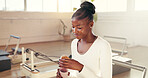 Fitness, pilates and water with black woman in studio for challenge, hydration or performance. Bottle, drink and exercise with happy person in health class for break, improvement or wellness