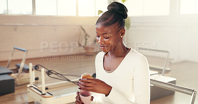 Buy stock photo Fitness, pilates and water with black woman in studio for challenge, holistic training or hydration. Bottle, exercise and reformer with happy person in health class for break, drink or wellness