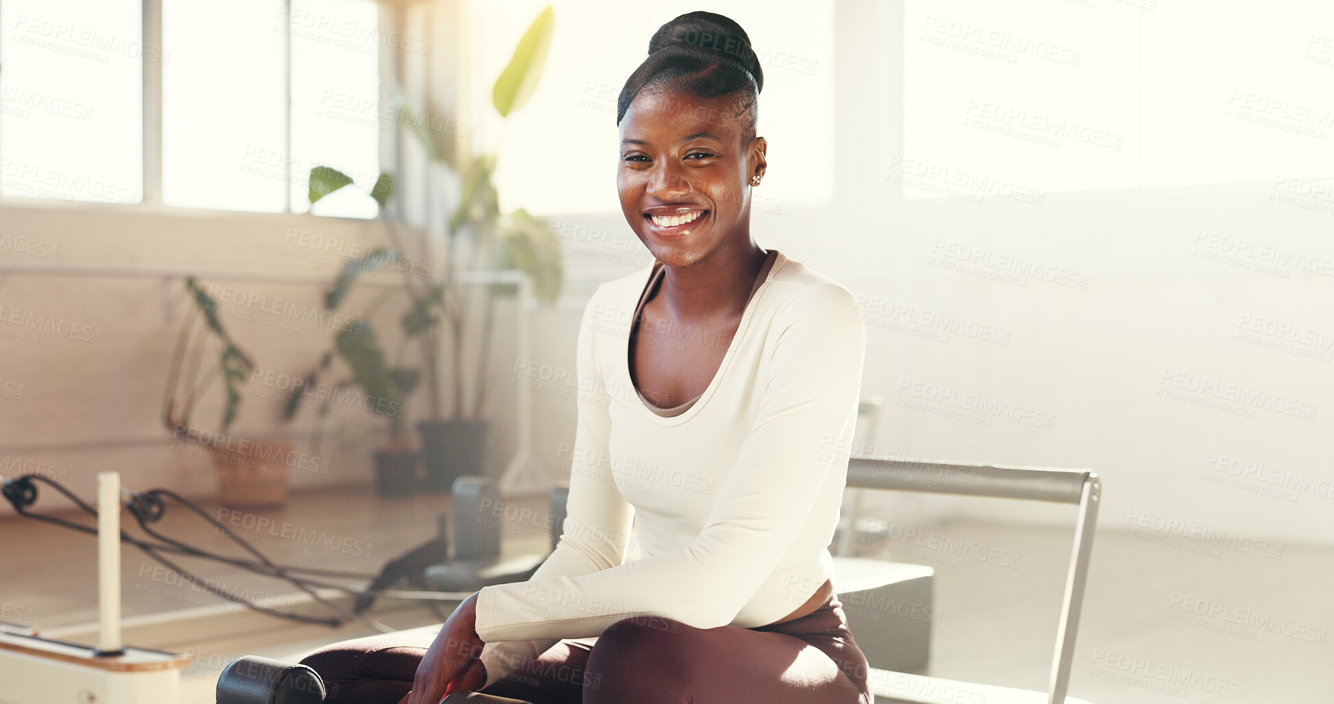 Buy stock photo Portrait, woman and pilates reformer for wellness, gym and equipment for workout, happy and healthy. Pride, smile and black person on machine for core strength, exercise or balance in fitness center