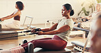 Pilates, exercise and woman in class with machine for core strength, workout and improve posture. Fitness club, yoga trainer and people with resistance equipment for wellness, health and balance