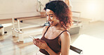 Happy woman, fitness and typing with phone in gym for conversation, social media or break. Active, female person and chat with smile on mobile smartphone for workout goals, rest or app in health club