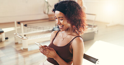 Buy stock photo Happy woman, fitness and typing with phone in gym for conversation, social media or break. Active, female person and chat with smile on mobile smartphone for workout goals, rest or app in health club