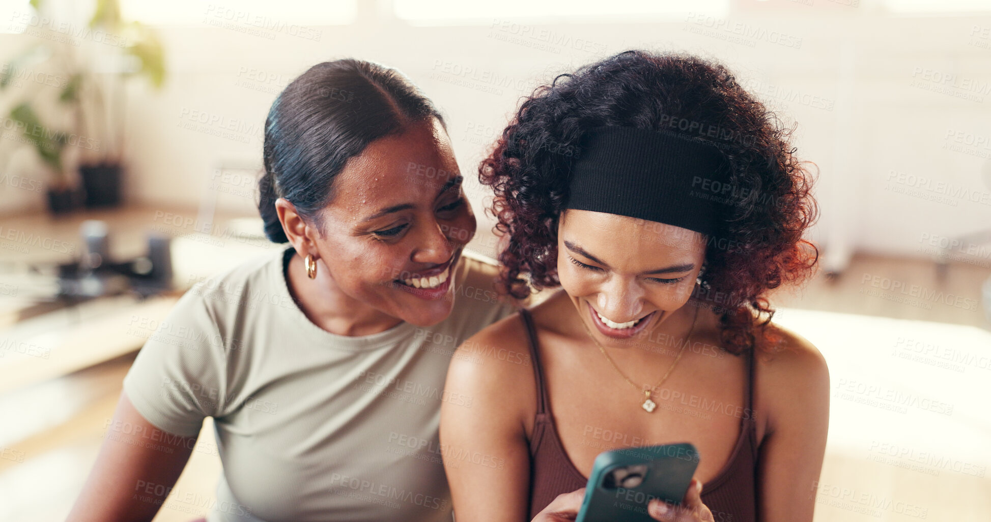 Buy stock photo Girl, friends and phone with laugh at pilates studio, break and happy with water, fitness and gossip on web. Women, meme and smartphone with mobile app, funny post or social media at wellness club