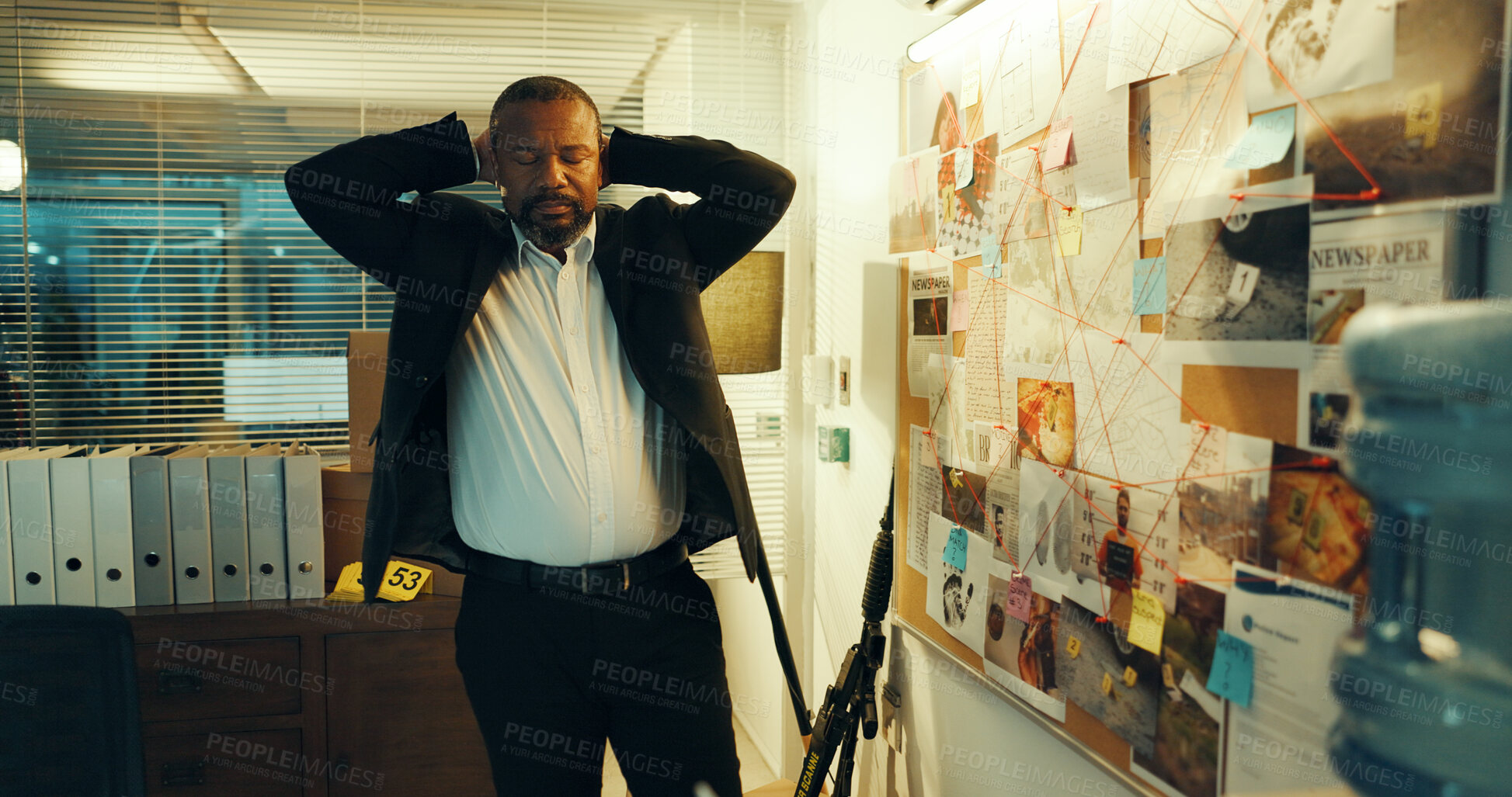 Buy stock photo Black man, detective and stress with evidence board for investigation, crime scene and clue mapping. Police, bulletin and urgent case with night, new Information and forensic review of deadline