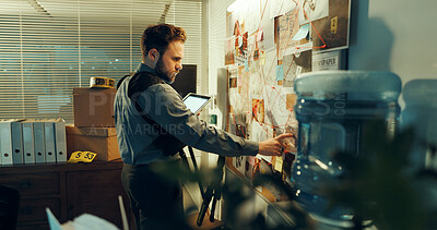 Buy stock photo Detective, man and board with evidence for investigation with tablet, case and criminal lead at police station. Investigator, problem solving and mindmap with tech for suspect and crime at night