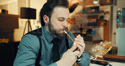 Buy stock photo Thinking, cigar and investigator in office with smoking for research on case with problem solving. Security, night and male private detective with surveillance, justice and evidence investigation