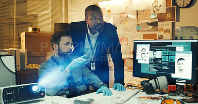Buy stock photo Computer screen, night and projector with detective people in office together for crime investigation. Display, evidence and pointing with police partners at work for evening collaboration on case