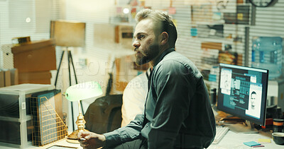 Buy stock photo Crime, investigation and thinking with police man in office at night for case or legal justice. Evidence, idea and problem solving with detective at desk in workplace for review of search findings