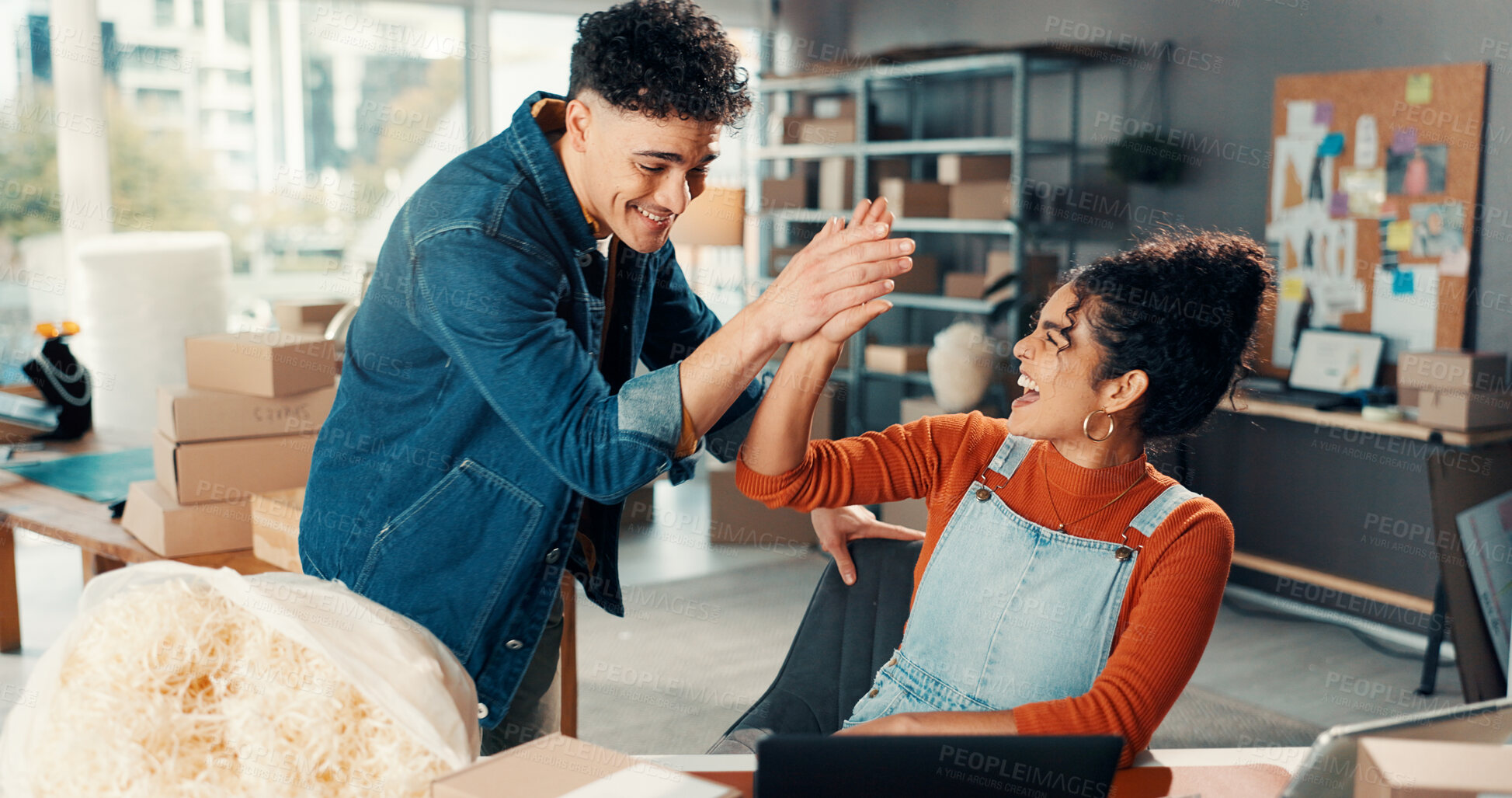 Buy stock photo Happy people, high five and winning with laptop for small business success, good news or logistics. Excited, woman and man with touch or boxes for shipping service, distribution or online review
