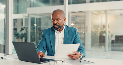 Buy stock photo Documents, laptop and reading with business black man in office for company management or research. Computer, paper and planning with mature manager at desk in workplace for administration report