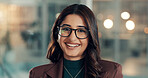 Portrait, smile and business woman in office as investment banker with ambition. Glasses, confident worker and happy professional with financial consultant, corporate advisor and bokeh in Dubai