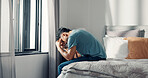 Frustrated, man and stress on bed at house with insomnia, sleeping disorder and depression. Tired, male person and mourning loss with mental health crisis, loneliness and emotional burnout in bedroom
