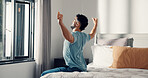 Stretching, wake up and morning with man in bedroom for routine, relax and thinking or reflection. Start of day, perspective and wellness with person in bed of home for peace, calm and inspiration