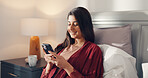 Woman, smartphone and relax in bed for communication, social media or reading ebook on weekend at home. Person, mobile app with text message or blog, email and contact with connectivity on day off