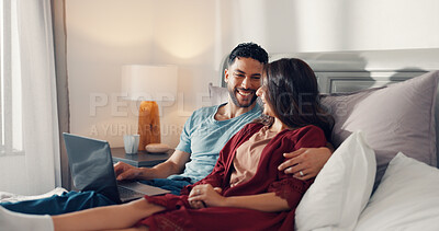 Buy stock photo Couple, laugh and relax in bed with laptop, streaming media and favorite series in home. Happy man, woman and tech in bedroom with love, digital subscription and watching comedy movie with connection