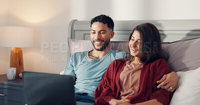 Buy stock photo Couple, smile and relax in bed with laptop, streaming media and favorite series in home. Happy man, woman and tech in bedroom with love, digital subscription and watching movie with connection