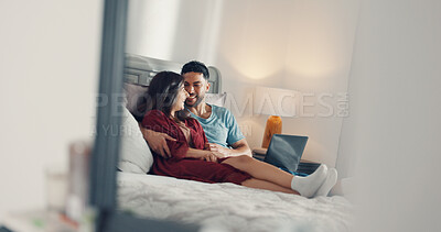 Buy stock photo Happy, relax and couple on bed in home with laptop for watching movie, series or show together. Smile, love and man with woman in bedroom for streaming film on computer for bonding in apartment.