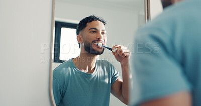 Buy stock photo Mirror, brushing and teeth with man in bathroom for hygiene, oral health and bad breath prevention. Male person, reflection and toothbrush for dental care, remove plaque and cleaning mouth at house