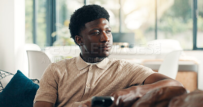 Buy stock photo Home, thinking and black man on sofa, smartphone and decision with break, social media and relax. Apartment, cellphone and African person on couch, thoughtful and calm with reflection, app or message
