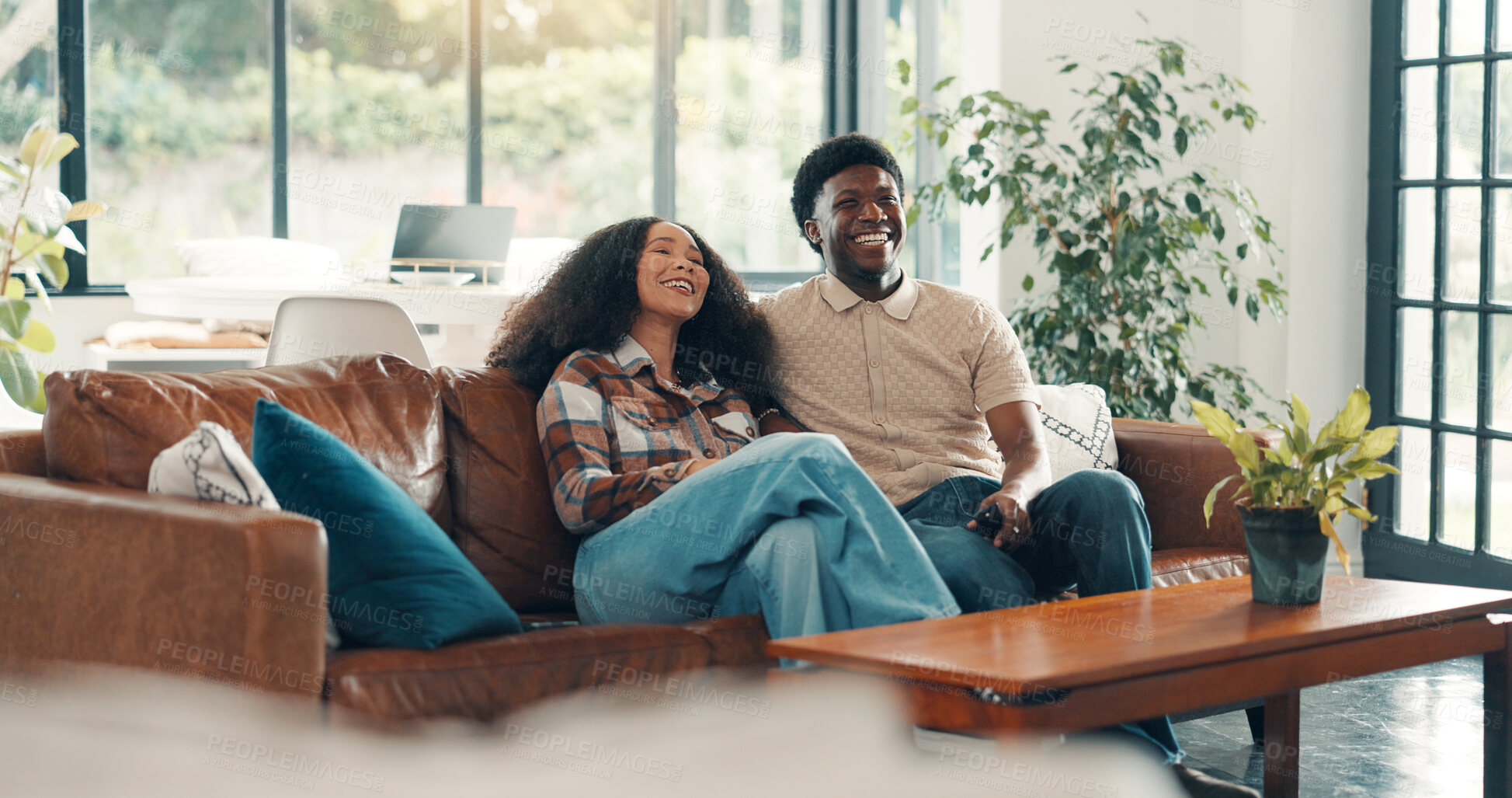 Buy stock photo Couple, home and watching TV with laugh, sofa and relax in living room for streaming subscription. Man, woman and happy for comedy movie, funny show or comfort in house with connection and remote