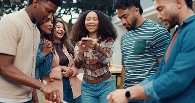 Buy stock photo Friends, backyard and people at party with phone for bonding, relaxing and fun memories on weekend. Happy, photograph and men with women in garden for BBQ celebration, social gathering and reunion