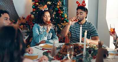 Buy stock photo Christmas, home and people with meal, alcohol and bonding together with happiness, festive and relax. Xmas, celebration and men with woman, food and champagne with tradition and holiday season