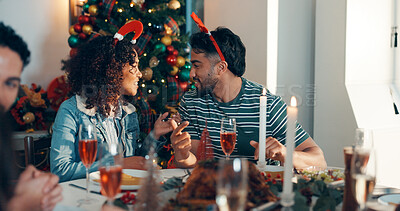 Buy stock photo People, friends and talk with lunch for Christmas holiday with festive food, celebration and tradition. Man, woman and chat and event of social gathering, buffet reunion and bonding together at house