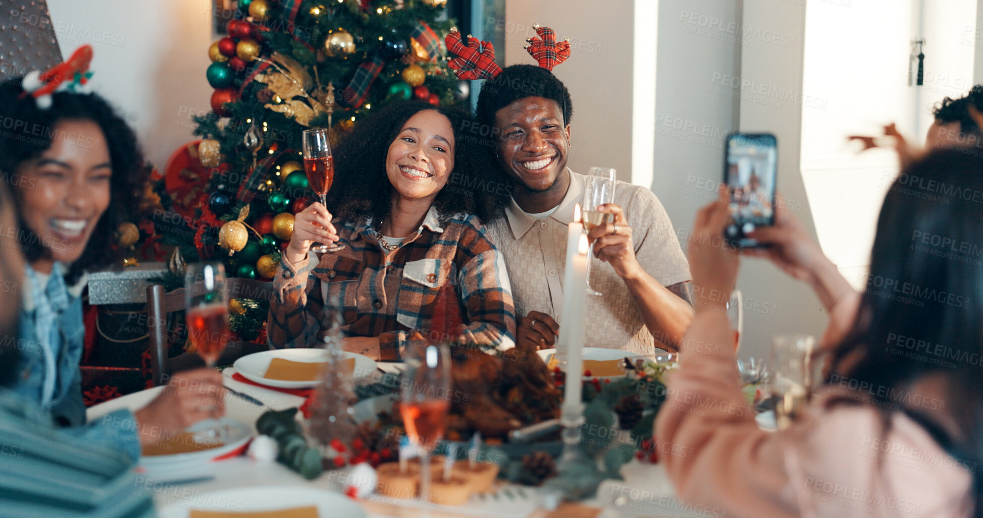 Buy stock photo Cheers, champaign and friends with phone for christmas celebration, festive reunion and social media post. Holiday, people and photography for bonding with xmas, profile picture and memory at house