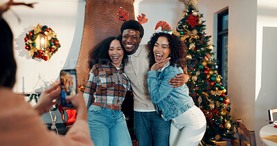 Buy stock photo Smile, group and friends with photography for Christmas celebration, festive reunion and social media post. Excited, people and holiday hug for bonding with xmas, profile picture and memory at house