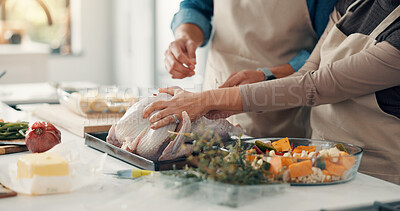 Buy stock photo Cooking, hands and couple in kitchen with turkey for meal prep, supper and festive lunch in home. Thanksgiving, vegetables and man with woman, ingredients and recipe for nutrition, dish or dinner