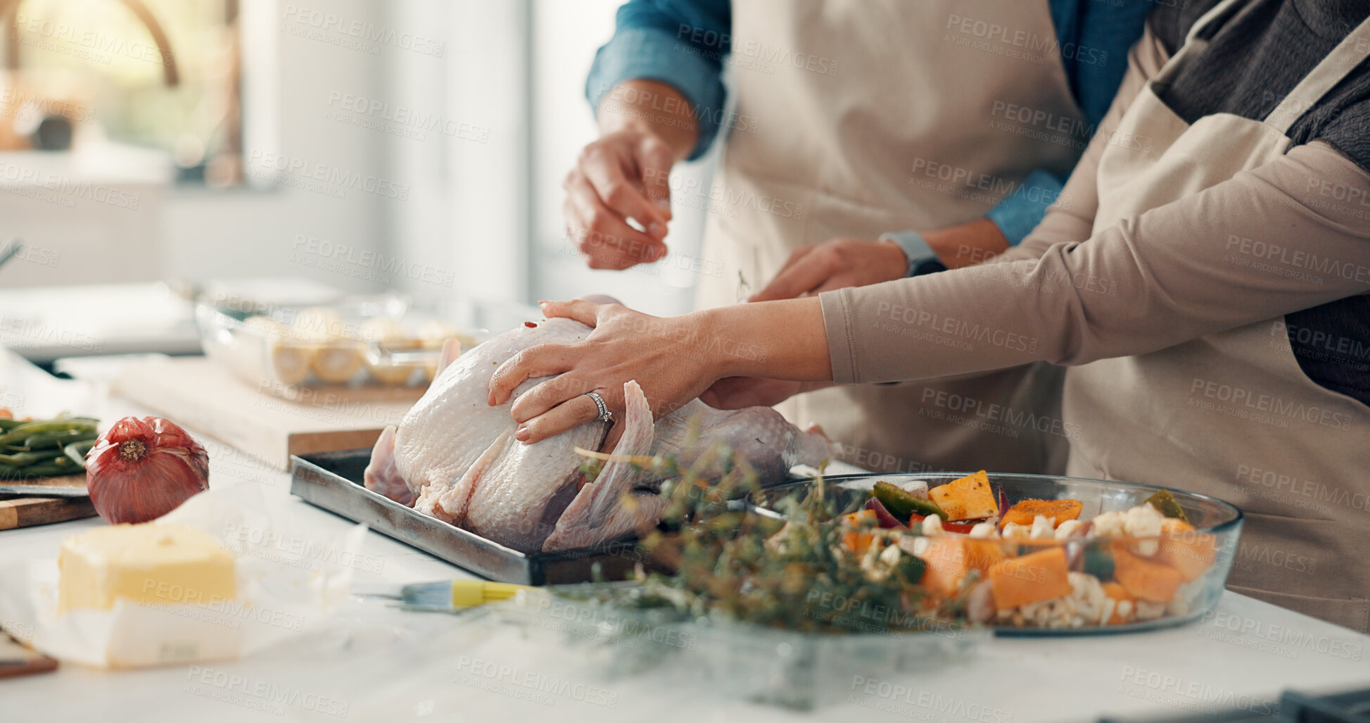 Buy stock photo Cooking, hands and couple in kitchen with turkey for meal prep, supper and festive lunch in home. Thanksgiving, vegetables and man with woman, ingredients and recipe for nutrition, dish or dinner
